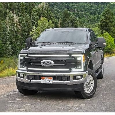 A Ford F250 truck equipped with the hybrid LED headlights installed on the factory bumper.