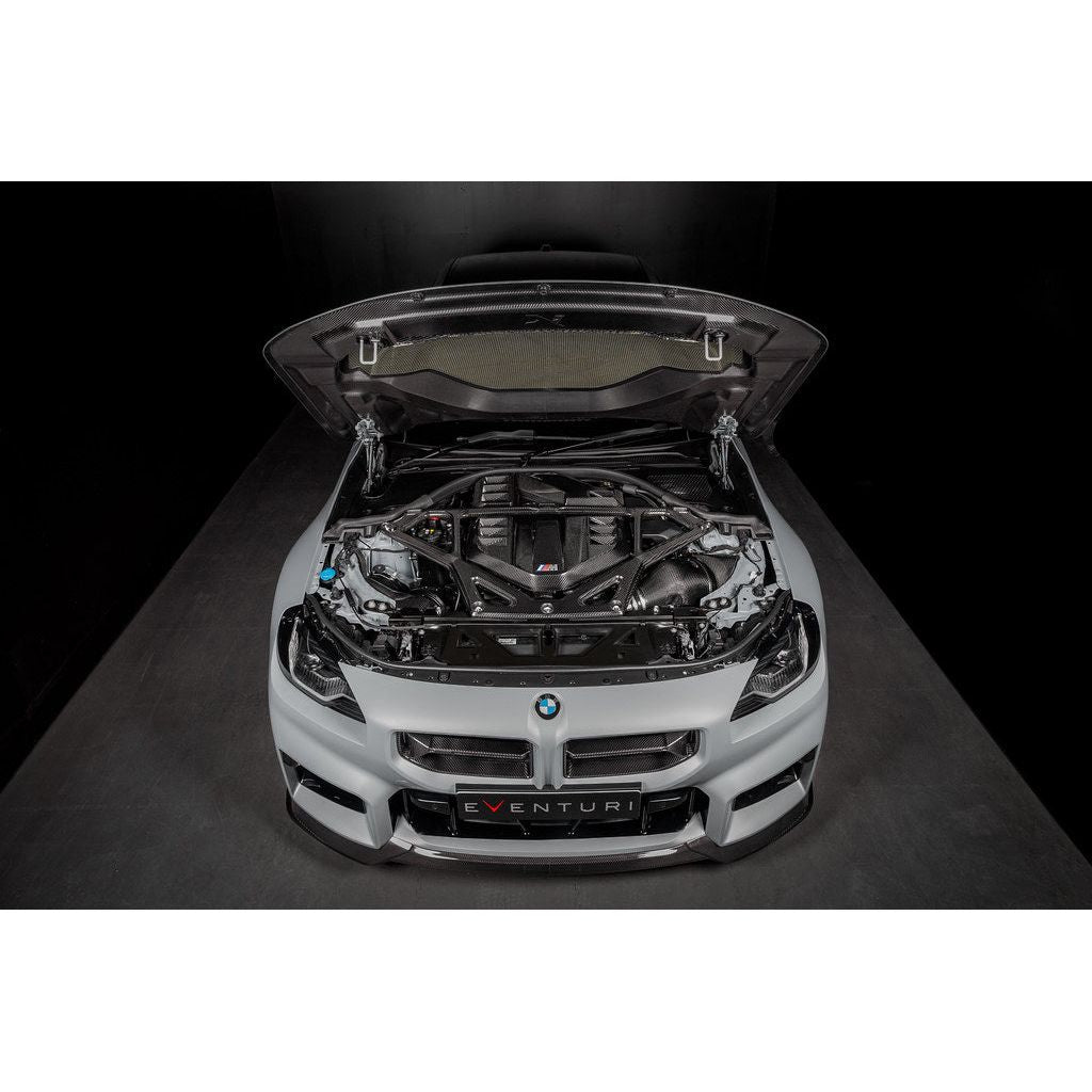 Eventuri gloss carbon CSL strut brace installed on BMW G8X M3 S58 engine bay