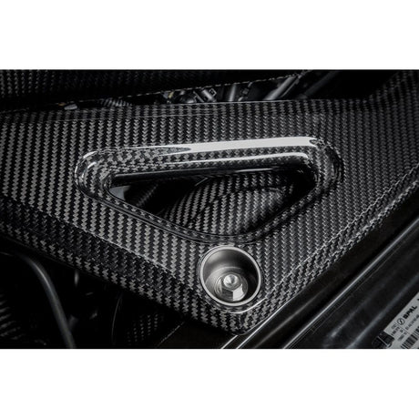 Eventuri gloss carbon CSL strut brace installed on BMW G8X M3 S58 engine bay