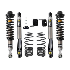 Set of OME shock absorbers and springs on a white background