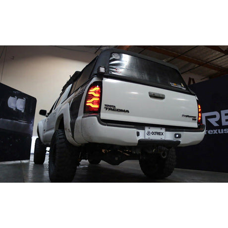 2005-2015 Toyota Tacoma | AlphaRex LUXX-Series LED Tail Lights Black - Truck Accessories Guy